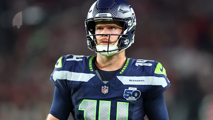 Sep 25, 2025; Glendale, Arizona, USA; Seattle Seahawks quarterback Sam Darnold (14) looks on in the second half against the Arizona Cardinals at State Farm Stadium. 