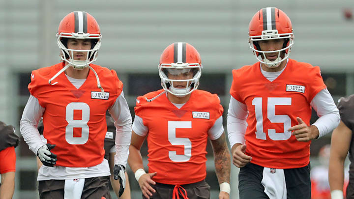 Cleveland Browns quarterbacks Kenny Pickett, left, Dillon Gabriel, center, and Joe Flacco warm up during an NFL practice at the Cleveland Browns training facility on Wednesday, May 28, 2025, in Berea, Ohio.