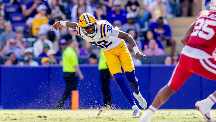 Nov 15, 2025; Baton Rouge, Louisiana, USA; LSU Tigers kicker Aeron Burrell (32) kicks off against the Arkansas Razorbacks during the first half at Tiger Stadium. Mandatory Credit: Stephen Lew-Imagn Images Nov 15, 2025; Baton Rouge, Louisiana, USA; LSU Tigers kicker Aeron Burrell (32) kicks off against the Arkansas Razorbacks during the first half at Tiger Stadium. Mandatory Credit: Stephen Lew-Imagn Images