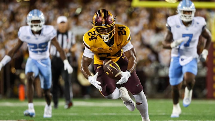 Aug 29, 2024; Minneapolis, Minnesota, USA; Minnesota Golden Gophers running back Marcus Major (24) fields a fumble against the North Carolina Tar Heels during the second half at Huntington Bank Stadium. Mandatory Credit: Matt Krohn-Imagn Images Aug 29, 2024; Minneapolis, Minnesota, USA; Minnesota Golden Gophers running back Marcus Major (24) fields a fumble against the North Carolina Tar Heels during the second half at Huntington Bank Stadium. Mandatory Credit: Matt Krohn-Imagn Images