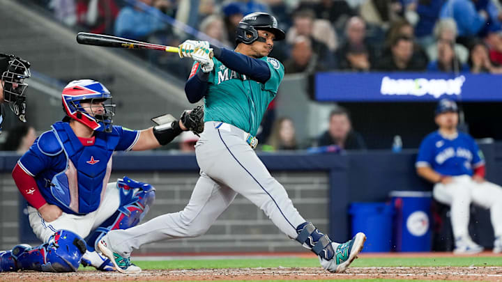 Oct 13, 2025; Toronto, Ontario, CAN; Seattle Mariners infielder Jorge Polanco (7) singles in the seventh inning against the Toronto Blue Jays during game two of the ALCS round for the 2025 MLB playoffs at Rogers Centre. Mandatory Credit: Nick Turchiaro-Imagn Images Oct 13, 2025; Toronto, Ontario, CAN; Seattle Mariners infielder Jorge Polanco (7) singles in the seventh inning against the Toronto Blue Jays during game two of the ALCS round for the 2025 MLB playoffs at Rogers Centre. Mandatory Credit: Nick Turchiaro-Imagn Images