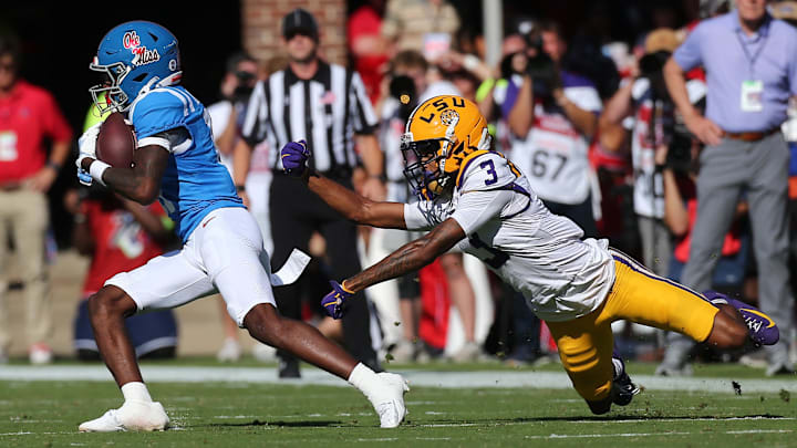 Sep 27, 2025; Oxford, Mississippi, USA; Mississippi Rebels wide receiver Deuce Alexander (11) runs after a catch as LSU Tigers cornerback DJ Pickett (3) attempts to make the tackle during the second quarter at Vaught-Hemingway Stadium. Mandatory Credit: Petre Thomas-Imagn Images Sep 27, 2025; Oxford, Mississippi, USA; Mississippi Rebels wide receiver Deuce Alexander (11) runs after a catch as LSU Tigers cornerback DJ Pickett (3) attempts to make the tackle during the second quarter at Vaught-Hemingway Stadium. Mandatory Credit: Petre Thomas-Imagn Images