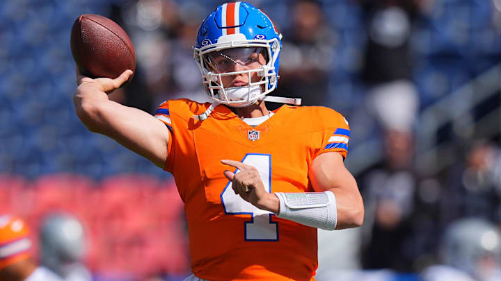 Oct 6, 2024; Denver, Colorado, USA; Denver Broncos quarterback Zach Wilson (4) warms up before the game against the Las Vegas Raiders at Empower Field at Mile High. 