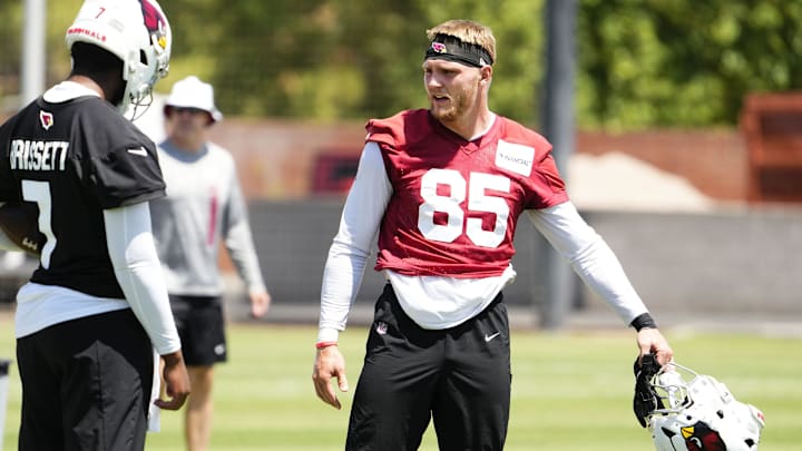 Arizona Cardinals tight end 	Trey McBride (85) talks to quarterback Jacoby Brissett (7) during organized team practice at the Arizona Cardinals training center in Tempe on June 3, 2025.