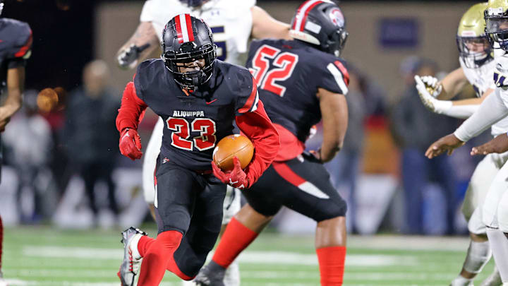 Aliquippa running back Tiqwai Hayes runs the ball against Bishop McDevitt in the 2022 PIAA Class 4A state championship game.