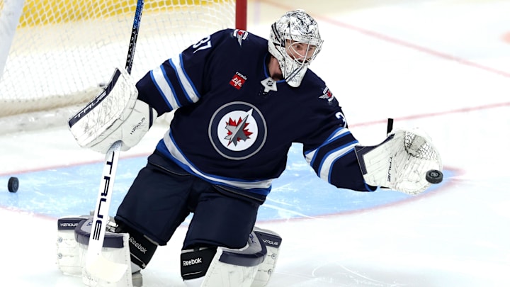 Jan 11, 2025; Winnipeg, Manitoba, CAN; Winnipeg Jets goaltender Connor Hellebuyck (37) warms up before a game against the Colorado Avalanche at Canada Life Centre. Mandatory Credit: James Carey Lauder-Imagn Images
