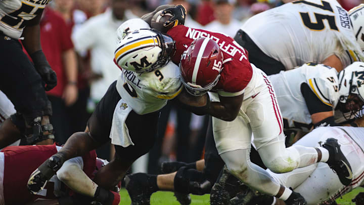 Oct 26, 2024; Tuscaloosa, Alabama, USA; Alabama Crimson Tide linebacker Justin Jefferson (15) brings down Missouri Tigers running back Marcus Carroll (9) during the fourth quarter at Bryant-Denny Stadium. Mandatory Credit: Will McLelland-Imagn Images Oct 26, 2024; Tuscaloosa, Alabama, USA; Alabama Crimson Tide linebacker Justin Jefferson (15) brings down Missouri Tigers running back Marcus Carroll (9) during the fourth quarter at Bryant-Denny Stadium. Mandatory Credit: Will McLelland-Imagn Images