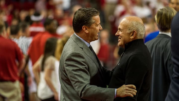 Jan 14, 2014; Fayetteville, AR, USA; Kentucky Wildcats John Calipari talks with Tyson Foods owner John Tyson before a game against the Arkansas Razorbacks at Bud Walton Arena. Arkansas defeated Kentucky 87-85 in overtime. Mandatory Credit: Beth Hall-Imagn Images