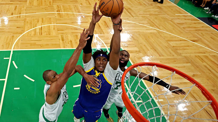 Jun 16, 2022; Boston, Massachusetts, USA; Golden State Warriors center Kevon Looney (5) shoots the ball against Boston Celtics center Al Horford (42) and Boston Celtics guard Jaylen Brown (7) in game six of the 2022 NBA Finals at TD Garden. Mandatory Credit: Kyle Terada-Imagn Images