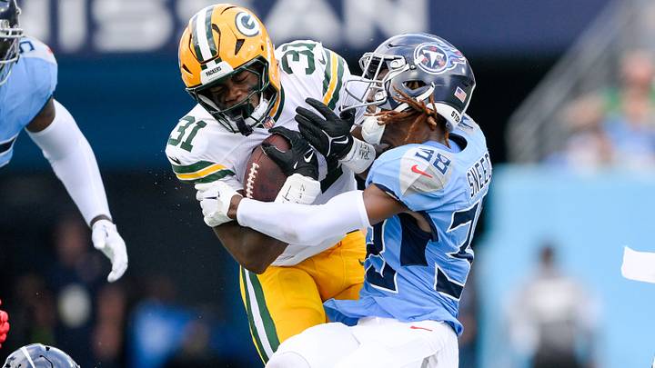 Sep 22, 2024; Nashville, Tennessee, USA; Tennessee Titans cornerback L'Jarius Sneed (38) tackles Green Bay Packers running back Emanuel Wilson (31) during the first half at Nissan Stadium. Mandatory Credit: Steve Roberts-Imagn Images Sep 22, 2024; Nashville, Tennessee, USA; Tennessee Titans cornerback L'Jarius Sneed (38) tackles Green Bay Packers running back Emanuel Wilson (31) during the first half at Nissan Stadium. Mandatory Credit: Steve Roberts-Imagn Images