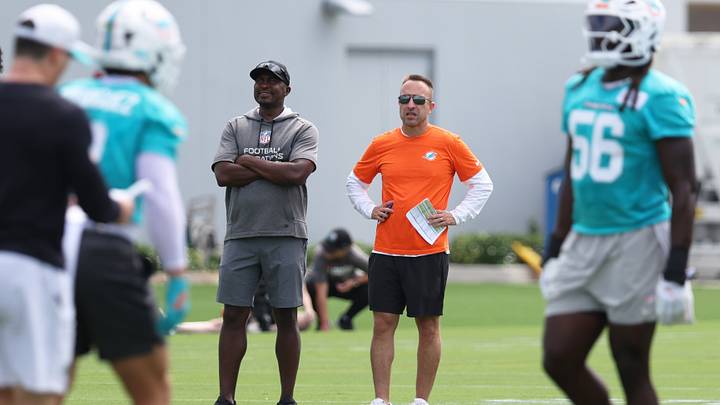 Miami Dolphins head coach Jeff Hafley watches a minicamp practice with defensive quality control coach Siriki Diabate at the Baptist Health Training Complex.