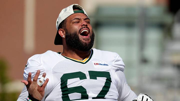 Green Bay Packers offensive lineman Donovan Jennings reacts while walking to practice at training camp. Green Bay Packers offensive lineman Donovan Jennings reacts while walking to practice at training camp.