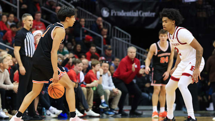Dec 21, 2024; Newark, New Jersey, USA; Princeton Tigers guard Xaivian Lee (1) looks to dribble past Rutgers Scarlet Knights guard Dylan Harper (2) during the first half at Prudential Center. Mandatory Credit: Tom Horak-Imagn Images Dec 21, 2024; Newark, New Jersey, USA; Princeton Tigers guard Xaivian Lee (1) looks to dribble past Rutgers Scarlet Knights guard Dylan Harper (2) during the first half at Prudential Center. Mandatory Credit: Tom Horak-Imagn Images