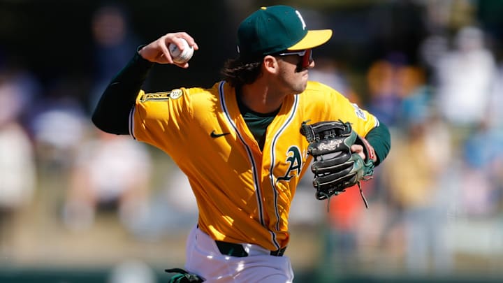 Apr 2, 2025; West Sacramento, California, USA; Athletics shortstop Jacob Wilson (5) fields a ground ball during the ninth inning against the Chicago Cubs at Sutter Health Park. Mandatory Credit: Sergio Estrada-Imagn Images Apr 2, 2025; West Sacramento, California, USA; Athletics shortstop Jacob Wilson (5) fields a ground ball during the ninth inning against the Chicago Cubs at Sutter Health Park. Mandatory Credit: Sergio Estrada-Imagn Images