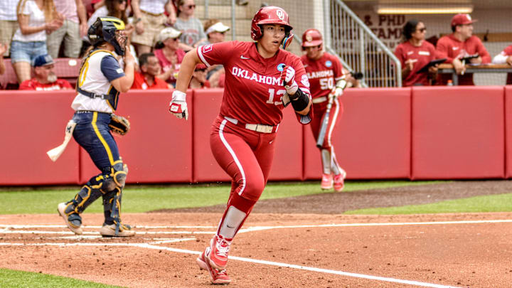 Oklahoma senior Isabela Emerling hustles toward first after a hit against Michigan in the NCAA Tournament at Love's Field. Oklahoma senior Isabela Emerling hustles toward first after a hit against Michigan in the NCAA Tournament at Love's Field.
