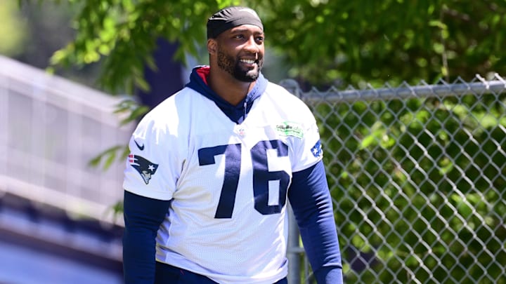 Jun 10, 2024; Foxborough, MA, USA; New England Patriots offensive tackle Calvin Anderson (76) walks to the practice fields for minicamp at Gillette Stadium. Mandatory Credit: Eric Canha-Imagn Images Jun 10, 2024; Foxborough, MA, USA; New England Patriots offensive tackle Calvin Anderson (76) walks to the practice fields for minicamp at Gillette Stadium. Mandatory Credit: Eric Canha-Imagn Images