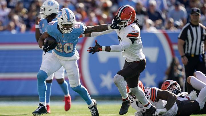 Tennessee Titans running back Tony Pollard (20) runs for a first down around Cleveland Browns safety Grant Delpit (9) during the fourth quarter at Nissan Stadium in Nashville, Tenn., Sunday, Oct. 25, 2026. Tennessee Titans running back Tony Pollard (20) runs for a first down around Cleveland Browns safety Grant Delpit (9) during the fourth quarter at Nissan Stadium in Nashville, Tenn., Sunday, Oct. 25, 2026.
