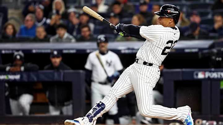 Oct 14, 2024; Bronx, New York, USA; New York Yankees outfielder Juan Soto (22) hits a solo home run during the third inning against the Cleveland Guardians in game one of the ALCS for the 2024 MLB Playoffs at Yankee Stadium. Mandatory Credit: Wendell Cruz-Imagn Images