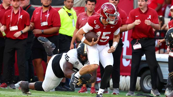 Oct 4, 2025; Tuscaloosa, Alabama, USA; Alabama Crimson Tide quarterback Ty Simpson (15) is tackled by Vanderbilt Commodores defensive lineman Aaron Bryant (55) during the second half at Saban Field at Bryant-Denny Stadium. Mandatory Credit: David Leong-Imagn Images Oct 4, 2025; Tuscaloosa, Alabama, USA; Alabama Crimson Tide quarterback Ty Simpson (15) is tackled by Vanderbilt Commodores defensive lineman Aaron Bryant (55) during the second half at Saban Field at Bryant-Denny Stadium. Mandatory Credit: David Leong-Imagn Images