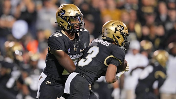 Sep 16, 2023; Boulder, Colorado, USA; Colorado Buffaloes quarterback Shedeur Sanders (2) hands off