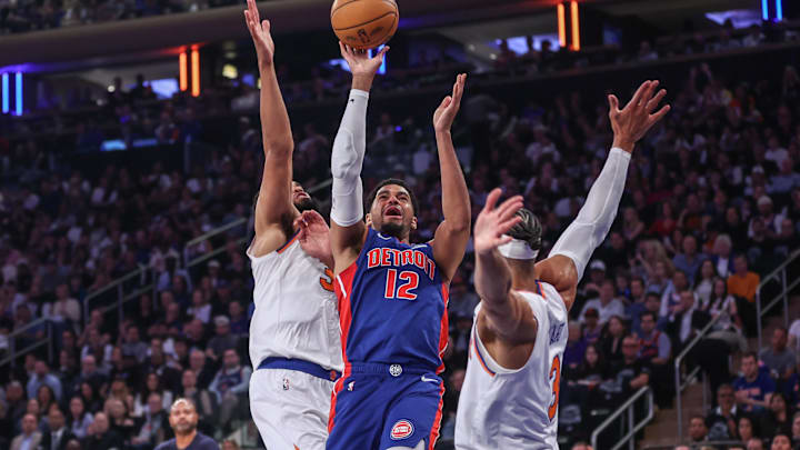 Apr 19, 2025; New York, New York, USA; Detroit Pistons forward Tobias Harris (12) looks to drive past New York Knicks center Karl-Anthony Towns (32) and guard Josh Hart (3) in Game One of the First Round of the NBA Playoffs at Madison Square Garden. Mandatory Credit: Wendell Cruz-Imagn Images