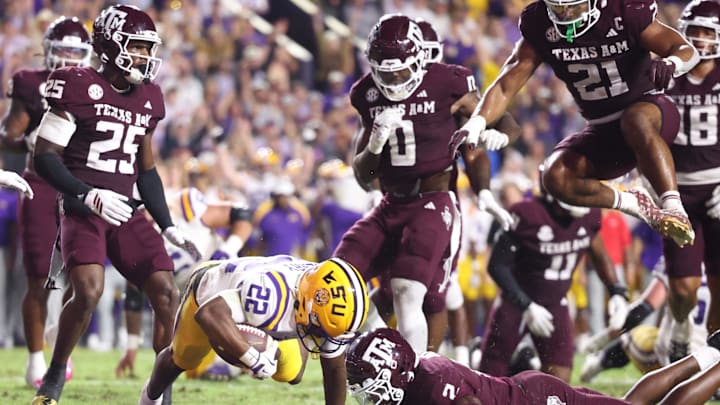 Oct 25, 2025; Baton Rouge, Louisiana, USA; Louisiana State Tigers running back Harlem Berry (22) scores a touchdown during the first half against the Texas A&M Aggies at Tiger Stadium. Mandatory Credit: Stephen Lew-Imagn Images Oct 25, 2025; Baton Rouge, Louisiana, USA; Louisiana State Tigers running back Harlem Berry (22) scores a touchdown during the first half against the Texas A&M Aggies at Tiger Stadium. Mandatory Credit: Stephen Lew-Imagn Images