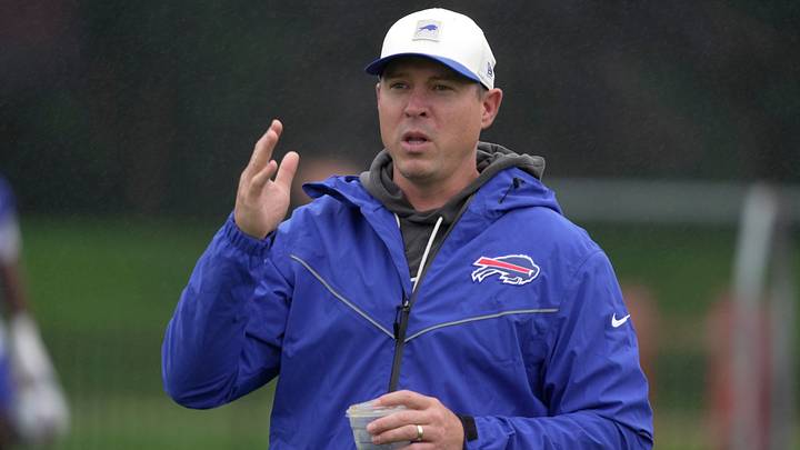 Bills defense coordinator Jim Leonhard talks to someone on the sidelines before practice at Bills Training Camp at St. John Fisher University in Pittsford on Aug. 13 2026. Bills defense coordinator Jim Leonhard talks to someone on the sidelines before practice at Bills Training Camp at St. John Fisher University in Pittsford on Aug. 13 2026.