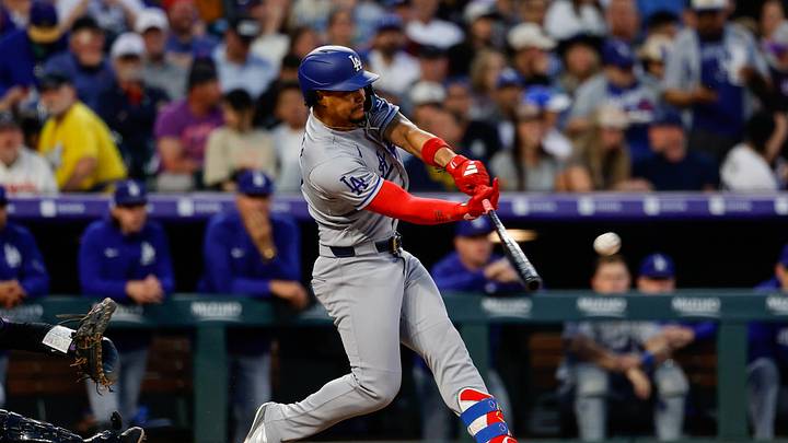 Apr 20, 2026; Denver, Colorado, USA; Los Angeles Dodgers second baseman Santiago Espinal (21) hits a single in the fourth inning against the Colorado Rockies at Coors Field. Mandatory Credit: Isaiah J. Downing-Imagn Images