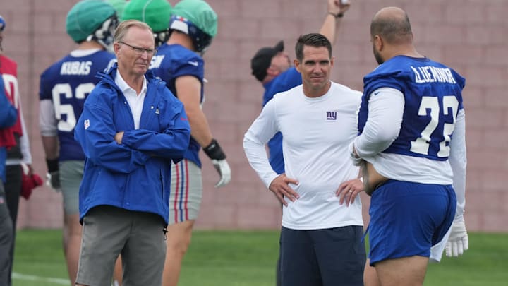 East Rutherford, NJ -- July 24, 2024 -- Owner John Mara and general manager Joe Schoen with left tackle, Jermaine Eluemunor after Eluemunor left practice with an injury during the first day of training camp for the 2024 New York Giants.