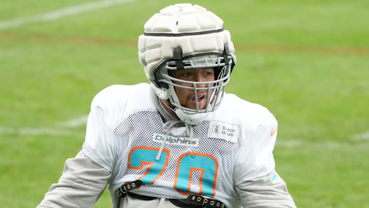Miami Dolphins offensive tackle Kendall Lamm (70) wears a Guardian helmet cap during practice at the PSD Bank Arena. Miami Dolphins offensive tackle Kendall Lamm (70) wears a Guardian helmet cap during practice at the PSD Bank Arena.