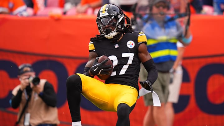 Sep 15, 2024; Denver, Colorado, USA; Pittsburgh Steelers cornerback Cory Trice Jr. (27) intercepts the ball in the fourth quarter against the Denver Broncos at Empower Field at Mile High. Mandatory Credit: Ron Chenoy-Imagn Images