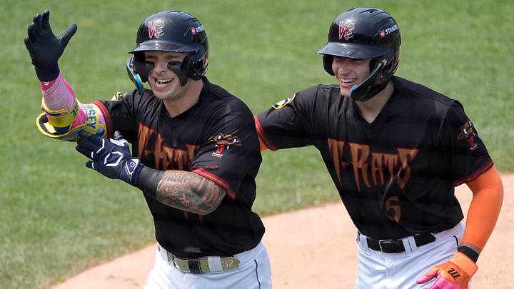 Wisconsin Timber Rattlers Andrew Fischer (11) celebrates with Marco Dinges (5) after hitting a three-run home run against the Great Lake Loons on Wednesday, June 10, 2026, at Neuroscience Group Field at Fox Cities Stadium in Grand Chute, Wisconsin. The Timber Rattlers won 5-0.