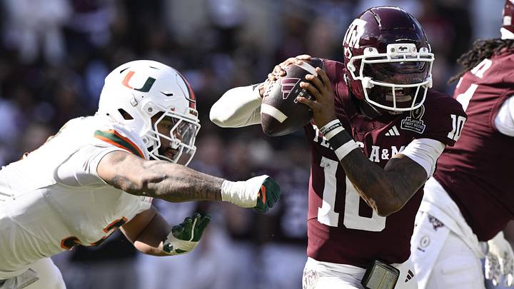 Texas A&M Aggies quarterback Marcel Reed (10) scrambles against Miami Hurricanes defensive lineman Akheem Mesidor (3) during the second half of the first round game of the CFP National Playoff at Kyle Field. Texas A&M Aggies quarterback Marcel Reed (10) scrambles against Miami Hurricanes defensive lineman Akheem Mesidor (3) during the second half of the first round game of the CFP National Playoff at Kyle Field.