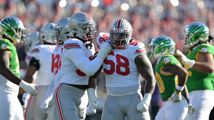 Jan 1, 2025; Pasadena, CA, USA; Ohio State Buckeyes defensive tackle Ty Hamilton (58) celebrates with defensive end Kenyatta Jackson Jr. (97) in the first quarter against the Oregon Ducks in the 2025 Rose Bowl college football quarterfinal game at Rose Bowl Stadium. Mandatory Credit: Jayne Kamin-Oncea-Imagn Images Jan 1, 2025; Pasadena, CA, USA; Ohio State Buckeyes defensive tackle Ty Hamilton (58) celebrates with defensive end Kenyatta Jackson Jr. (97) in the first quarter against the Oregon Ducks in the 2025 Rose Bowl college football quarterfinal game at Rose Bowl Stadium. Mandatory Credit: Jayne Kamin-Oncea-Imagn Images