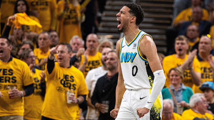 Apr 29, 2025; Indianapolis, Indiana, USA; Indiana Pacers guard Tyrese Haliburton (0) reacts during a time out during game five of the first round for the 2024 NBA Playoffs against the Milwaukee Bucks at Gainbridge Fieldhouse. Mandatory Credit: Trevor Ruszkowski-Imagn Images