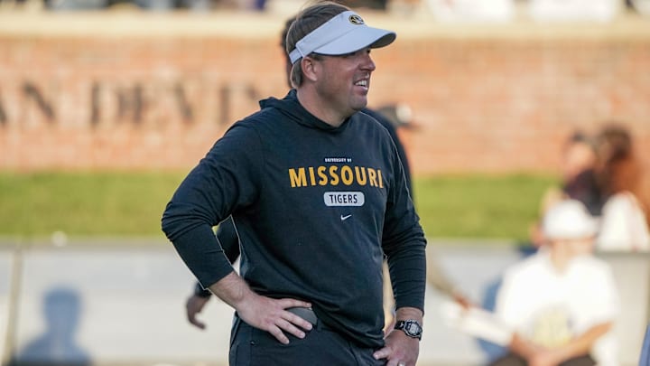 Oct 1, 2022; Columbia, Missouri, USA; Missouri Tigers head coach Eli Drinkwitz watches warm ups against the Georgia Bulldogs prior to a game at Faurot Field at Memorial Stadium. Mandatory Credit: Denny Medley-Imagn Images Oct 1, 2022; Columbia, Missouri, USA; Missouri Tigers head coach Eli Drinkwitz watches warm ups against the Georgia Bulldogs prior to a game at Faurot Field at Memorial Stadium. Mandatory Credit: Denny Medley-Imagn Images