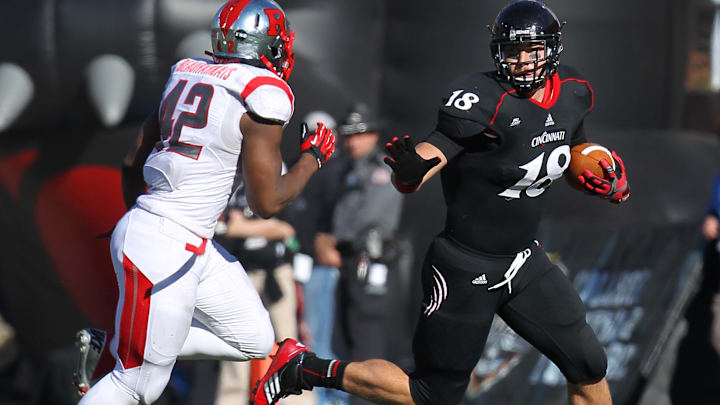 UCRutgers Sports Saturday November 17, 2012: Cincinnati TE Travis Kelce (18) caught a pass and fights for extra yardage against Rutgers University MLB Steve Beauharnais (42) in the third quarter. Cincinnati Bearcats and Rutgers University battles in a NCAA football game at Nippert Stadium Saturday November 17, 2012. Cincinnati lost 10 to 3 against Rutgers. The Enquirer/ Joseph Fuqua II UCRutgers Sports Saturday November 17, 2012: Cincinnati TE Travis Kelce (18) caught a pass and fights for extra yardage against Rutgers University MLB Steve Beauharnais (42) in the third quarter. Cincinnati Bearcats and Rutgers University battles in a NCAA football game at Nippert Stadium Saturday November 17, 2012. Cincinnati lost 10 to 3 against Rutgers. The Enquirer/ Joseph Fuqua II