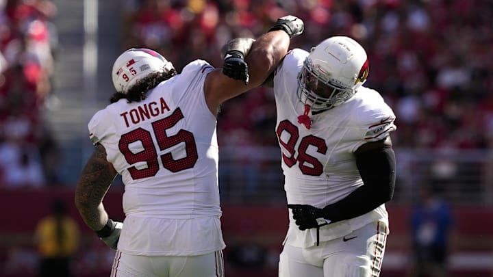 Oct 6, 2024; Santa Clara, California, USA; Arizona Cardinals defensive tackle Naquan Jones (96) celebrates with defensive tackle Khyiris Tonga (95) after recording a sack against the San Francisco 49ers during the third quarter at Levi's Stadium. Mandatory Credit: Darren Yamashita-Imagn Images