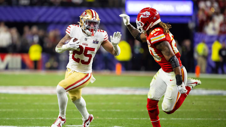 Feb 11, 2024; Paradise, Nevada, USA; San Francisco 49ers running back Elijah Mitchell (25) against Kansas City Chiefs safety Justin Reid (20) in Super Bowl LVIII at Allegiant Stadium. Mandatory Credit: Mark J. Rebilas-Imagn Images