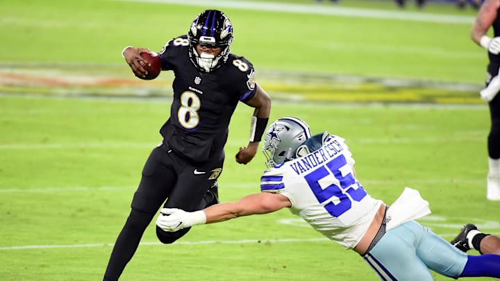 Dec 8, 2020; Baltimore, Maryland, USA; Baltimore Ravens quarterback Lamar Jackson (8) avoids the