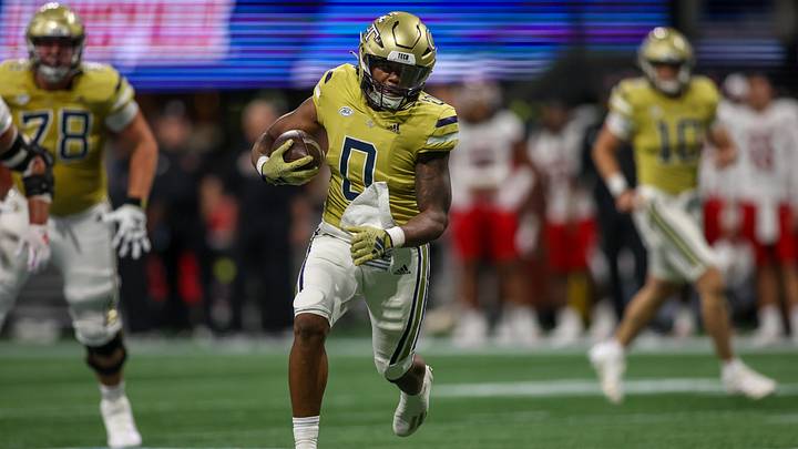 Georgia Tech running back Trey Cooley (0) runs the ball for a touchdown against his former team, Louisville, in 2023. Georgia Tech running back Trey Cooley (0) runs the ball for a touchdown against his former team, Louisville, in 2023.