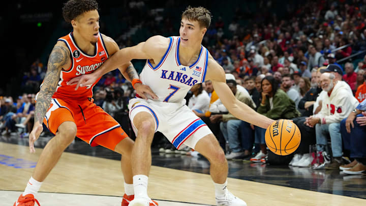 Nov 25, 2025; Las Vegas, Nevada, USA; Syracuse Orange guard Nate Kingz (4) defends against Kansas Jayhawks guard Kohl Rosario (7) during the first half in a 2025 Players Era Festival group play game at MGM Grand Garden Arena. Mandatory Credit: Stephen R. Sylvanie-Imagn Images