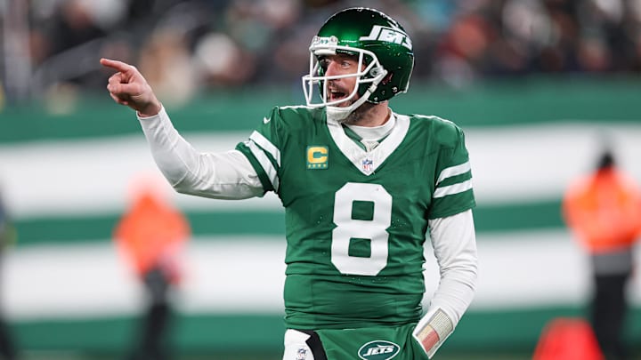 Jan 5, 2025; East Rutherford, New Jersey, USA; New York Jets quarterback Aaron Rodgers (8) gestures towards the Miami Dolphins bench during the second half at MetLife Stadium.