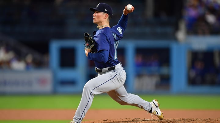 Seattle Mariners pitcher Bryan Woo throws against the Los Angeles Dodgers on Monday at Dodger Stadium. Seattle Mariners pitcher Bryan Woo throws against the Los Angeles Dodgers on Monday at Dodger Stadium.