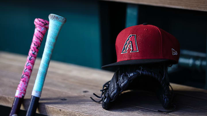Jun 7, 2023; Washington, District of Columbia, USA; A general view of an Arizona Diamondbacks hat, glove, and bats in the dugout during the fifth inning of the game against the Washington Nationals at Nationals Park. Mandatory Credit: Scott Taetsch-Imagn Images