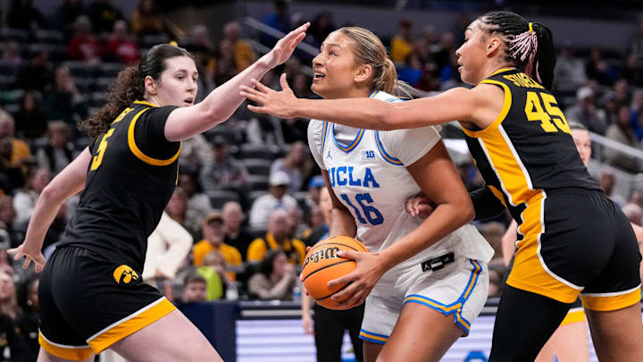 UCLA Bruins forward Sienna Betts (16) rushes up the the paint against Iowa Hawkeyes forward Hannah Stuelke (45) and Iowa Hawkeyes center Ava Heiden (5) on Sunday, March 8, 2026, during the Big Ten Tournament Championship game at Gainbridge Fieldhouse in Indianapolis. UCLA Bruins forward Sienna Betts (16) rushes up the the paint against Iowa Hawkeyes forward Hannah Stuelke (45) and Iowa Hawkeyes center Ava Heiden (5) on Sunday, March 8, 2026, during the Big Ten Tournament Championship game at Gainbridge Fieldhouse in Indianapolis.