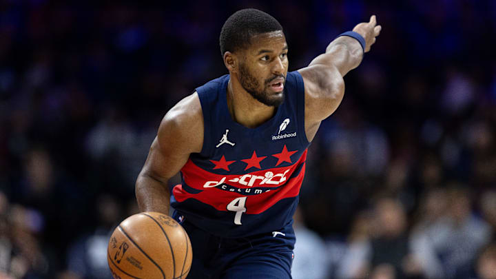 Jan 8, 2025; Philadelphia, Pennsylvania, USA; Washington Wizards guard Jared Butler (4) controls the ball against the Philadelphia 76ers during the second quarter at Wells Fargo Center. Mandatory Credit: Bill Streicher-Imagn Images