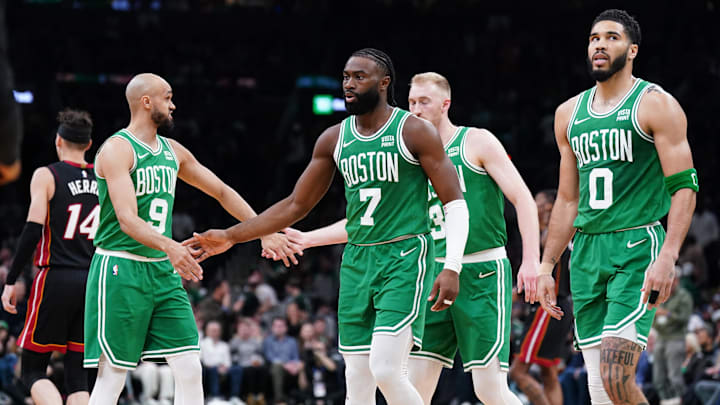 Apr 24, 2024; Boston, Massachusetts, USA; Boston Celtics guard Jaylen Brown (7), forward Jayson Tatum (0), guard Derrick White (9) and forward Sam Hauser (30) walk to the bench during a timeout against the Miami Heat in the second quarter during game two of the first round for the 2024 NBA playoffs at TD Garden. Mandatory Credit: David Butler II-Imagn Images