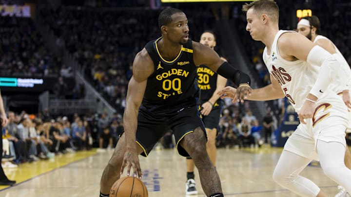 Dec 30, 2024; San Francisco, California, USA; Cleveland Cavaliers guard Sam Merrill (5) defends against Golden State Warriors forward Jonathan Kuminga (00) during the second quarter at Chase Center. Mandatory Credit: John Hefti-Imagn Images