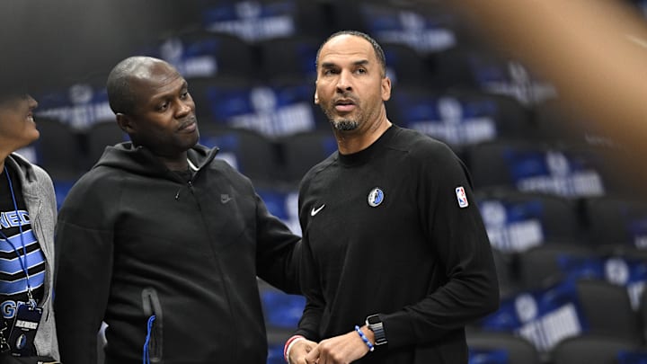 Oct 7, 2024; Dallas, Texas, USA; Dallas Mavericks general manager Nico Harrison (right) looks on during warms up before the game between the Dallas Mavericks and the Memphis Grizzlies at the American Airlines Center. Mandatory Credit: Jerome Miron-Imagn Images